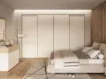 Camera da letto in stile nordico con letto accogliente, armadio a scomparsa e comò in legno chiaro.