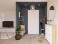 Ingresso accogliente con panca, specchio ovale e scarpiera bianca. Un tappeto geometrico e piante verdi completano le idee ingresso casa elegante.