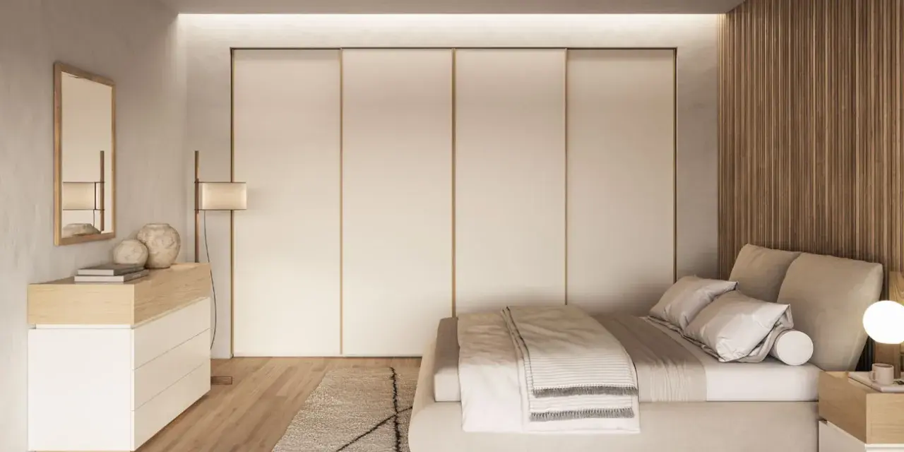 Camera da letto in stile nordico con letto accogliente, armadio a scomparsa e comò in legno chiaro.