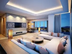 Luminoso soggiorno con divano angolare, tavolo da pranzo e splendida vista panoramica. Le **idee controsoffitto** con illuminazione integrata creano un'atmosfera accogliente.
