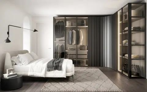 Elegante armadio angolare misure personalizzabili, con ante in vetro e illuminazione interna, che valorizza un guardaroba ordinato.