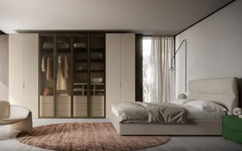 Camera da letto moderna con letto, armadio a vista e poltrona. Ottimi spunti su come disporre i mobili in camera da letto per un look elegante.