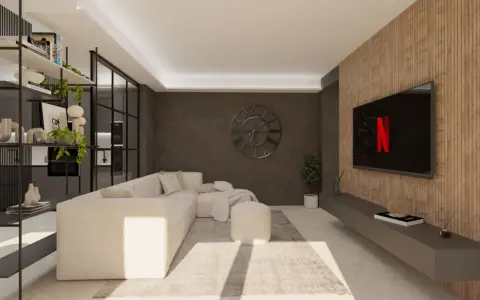 Accogliente soggiorno stile industriale con divano bianco, libreria metallica e TV su parete in legno.