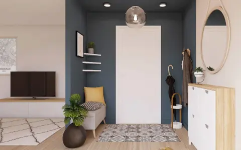 Ingresso accogliente con panca, specchio ovale e scarpiera bianca. Un tappeto geometrico e piante verdi completano le idee ingresso casa elegante.