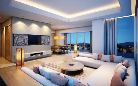 Luminoso soggiorno con divano angolare, tavolo da pranzo e splendida vista panoramica. Le **idee controsoffitto** con illuminazione integrata creano un'atmosfera accogliente.