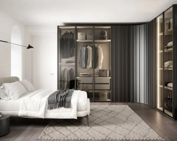 Elegante armadio angolare misure personalizzabili, con ante in vetro e illuminazione interna, che valorizza un guardaroba ordinato.