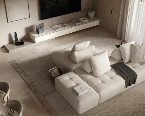 Soggiorno con divano componibile beige, tappeto a pelo lungo e un tavolo da pranzo. L'arredamento minimalista crea un'atmosfera serena.