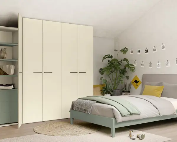 Camera da letto moderna con letto una piazza e mezza, armadio bianco e piante verdi.