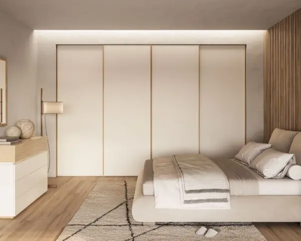 Camera da letto in stile nordico con letto accogliente, armadio a scomparsa e comò in legno chiaro.