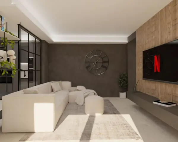 Accogliente soggiorno stile industriale con divano bianco, libreria metallica e TV su parete in legno.