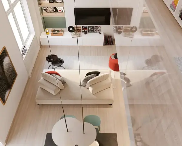 Arredamento soggiorno moderno con divano bianco, tavolino nero, quadro cactus e giradischi.