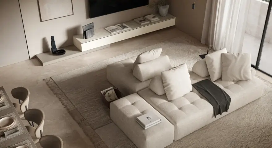 Soggiorno con divano componibile beige, tappeto a pelo lungo e un tavolo da pranzo. L'arredamento minimalista crea un'atmosfera serena.