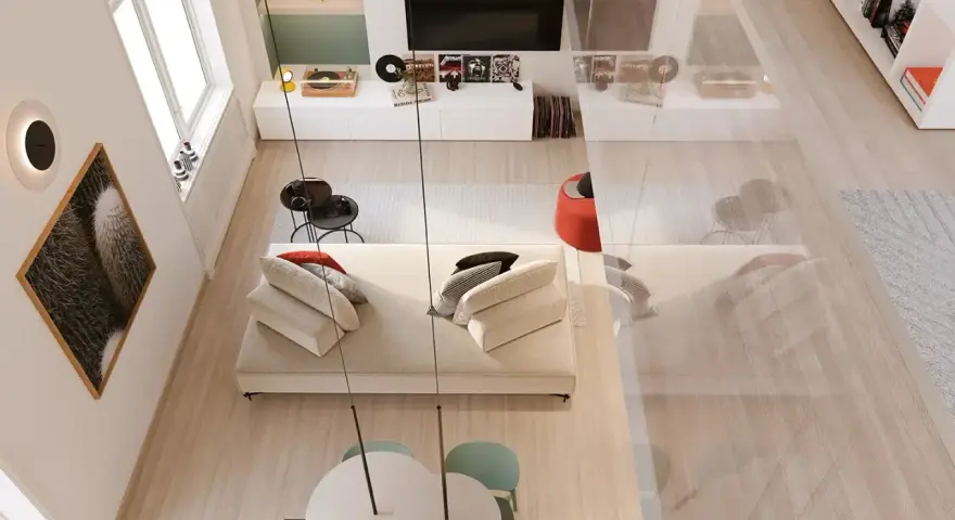 Arredamento soggiorno moderno con divano bianco, tavolino nero, quadro cactus e giradischi.