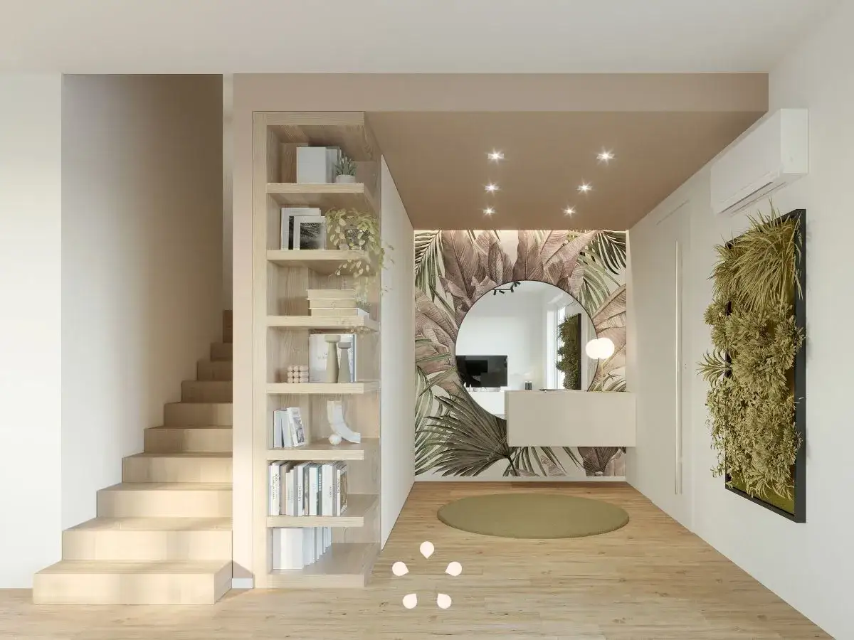 Ingresso grande con libreria in legno, specchio rotondo, carta da parati tropicale e verde verticale. Idee per arredare un ingresso grande.